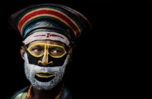 A Papua New Guinea tribesman in traditional face makeup