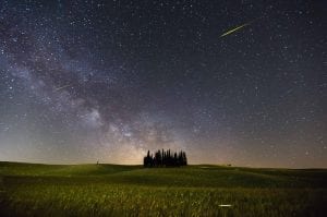 A shooting star, or comet, flashing across the night sky