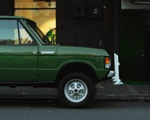 A green, classic Land Rover Range Rover