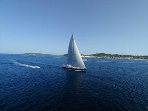 A sailing boat cruising along deep blue Mediterranean Sea, Saint Tropez