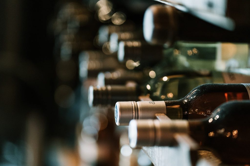 a wine rack full of different wines