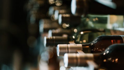 a wine rack full of different wines