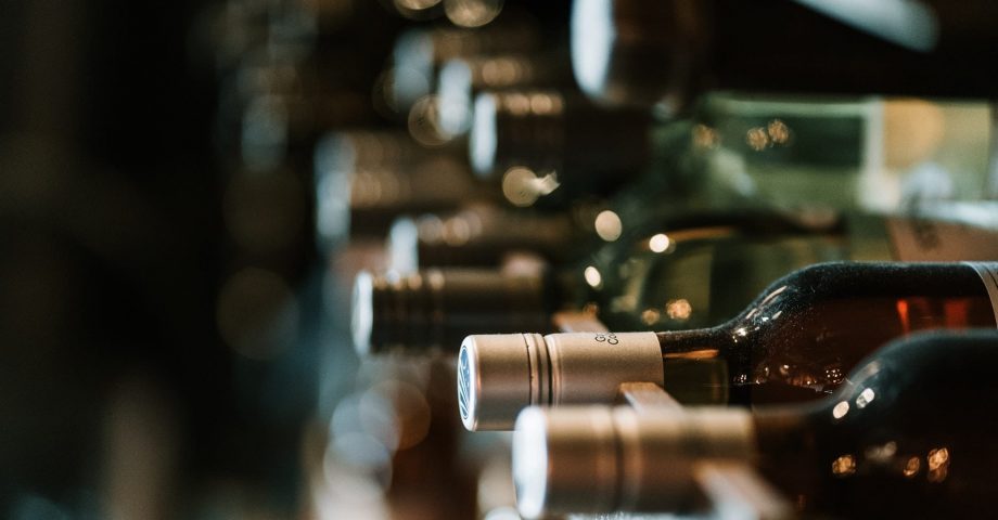 a wine rack full of different wines