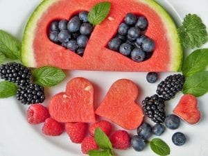 a selection of fruit shaped in to a heart