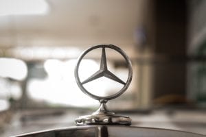 The unmistakable bonnet ornament of a Mercedes Benz