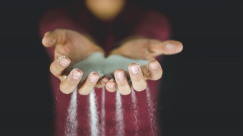 grains of sand falling through fingers