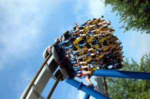 people enjoying a rollercoaster ride