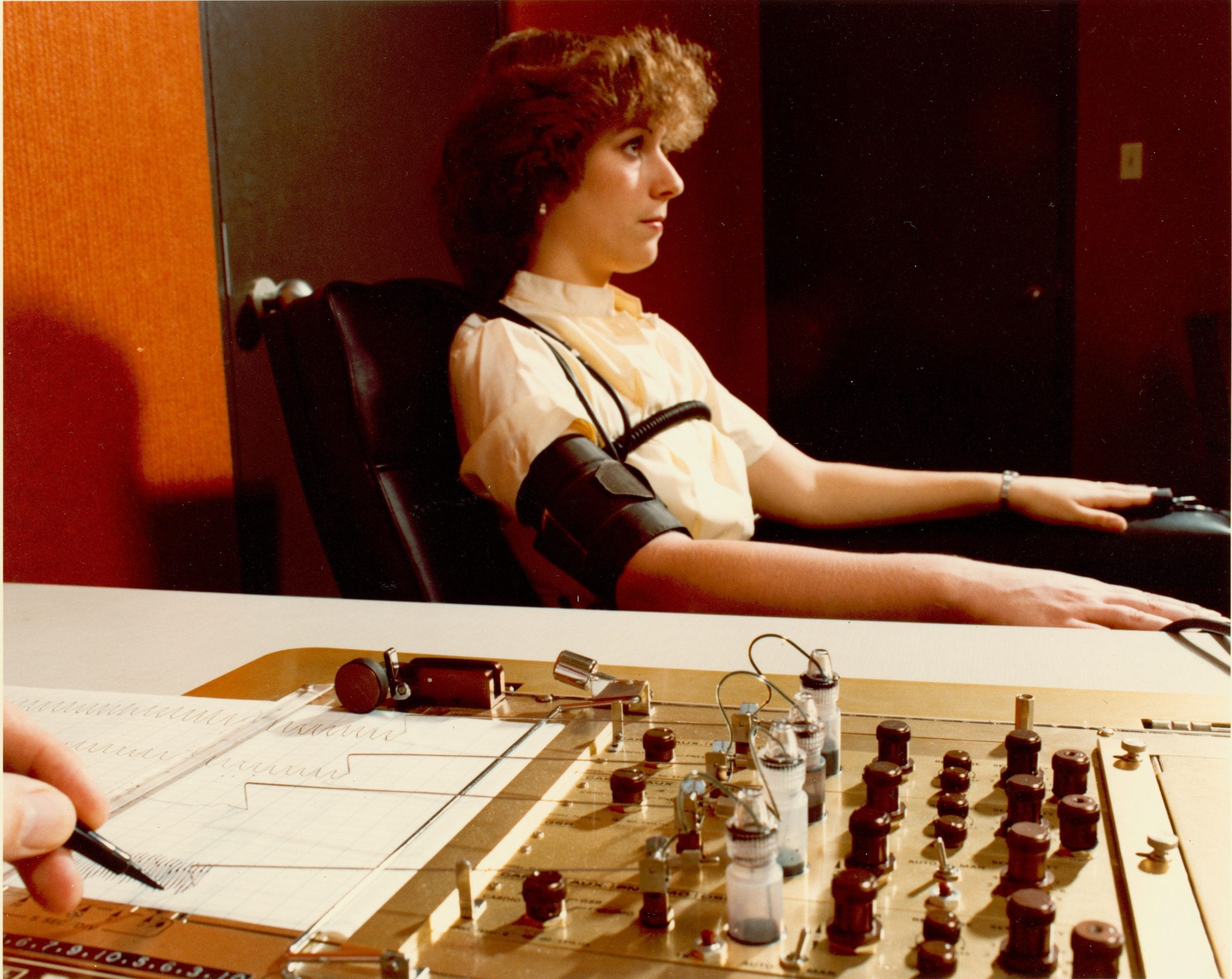 woman taking a lie detector test