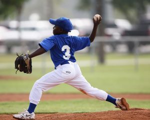 young man playing baseball