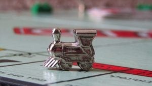 A Monopoly board with the 'train' user