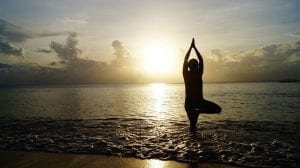 yogic meditating on the beach 