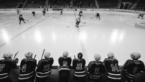 Watching the Ice Hockey Game from the sidelines