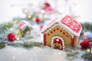 a gingerbread house dressed for Christmas