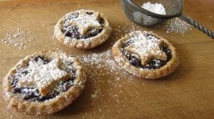 mince pies with a pastry star, dusted in icing sugar