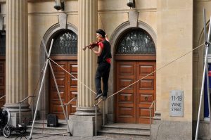 man on a Tightrope AND playing the violin!