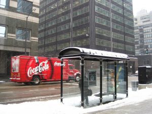 Coca Cola truck driving down a street