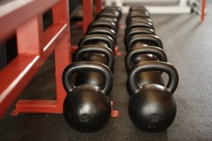 a large selection of kettle bells, ready for your workout!