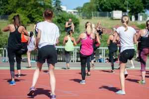 a group of people taking part in a Zumba class