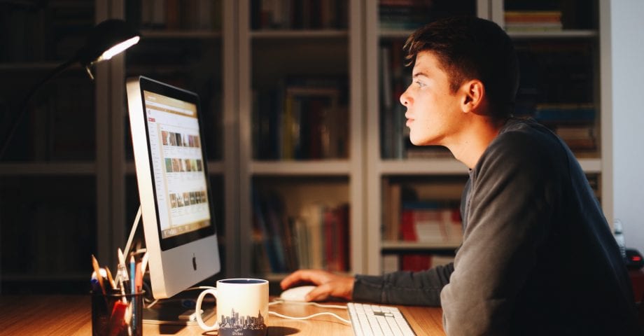 Man scrolling Youtube on computer