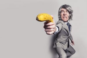 Man pointing with a banana