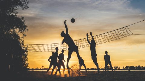 a volleyball match on the beach