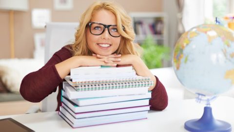 blonde female student with books